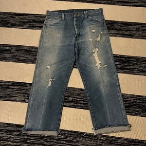 Cropped, distressed vintage wranglers